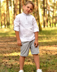 Boys’ white embroidered linen shirt with stand collar and geometric ornament