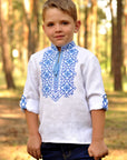 Festive boys’ white linen vyshyvanka with double-cross blue embroidery and 3/4 sleeves