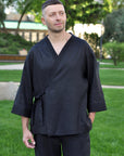 Men’s black linen outfit with embroidered kimono top and relaxed straight-cut trousers