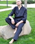 Full-length view of a men’s black linen two-piece set with kimono top and loose pants