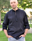 Black men’s linen vyshyvanka with black-on-black embroidery and transformable long sleeves