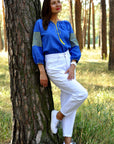 Blue women’s vyshyvanka with geometric ornament inspired by the Ukrainian flag