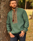 Green linen embroidered men`s shirt with geometric ornament