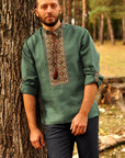 Green linen embroidered men`s shirt with geometric ornament