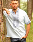 Light embroidered men`s shirt with short sleeve