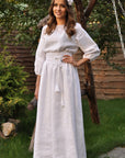 White linen wedding dress with delicate white-on-white embroidery