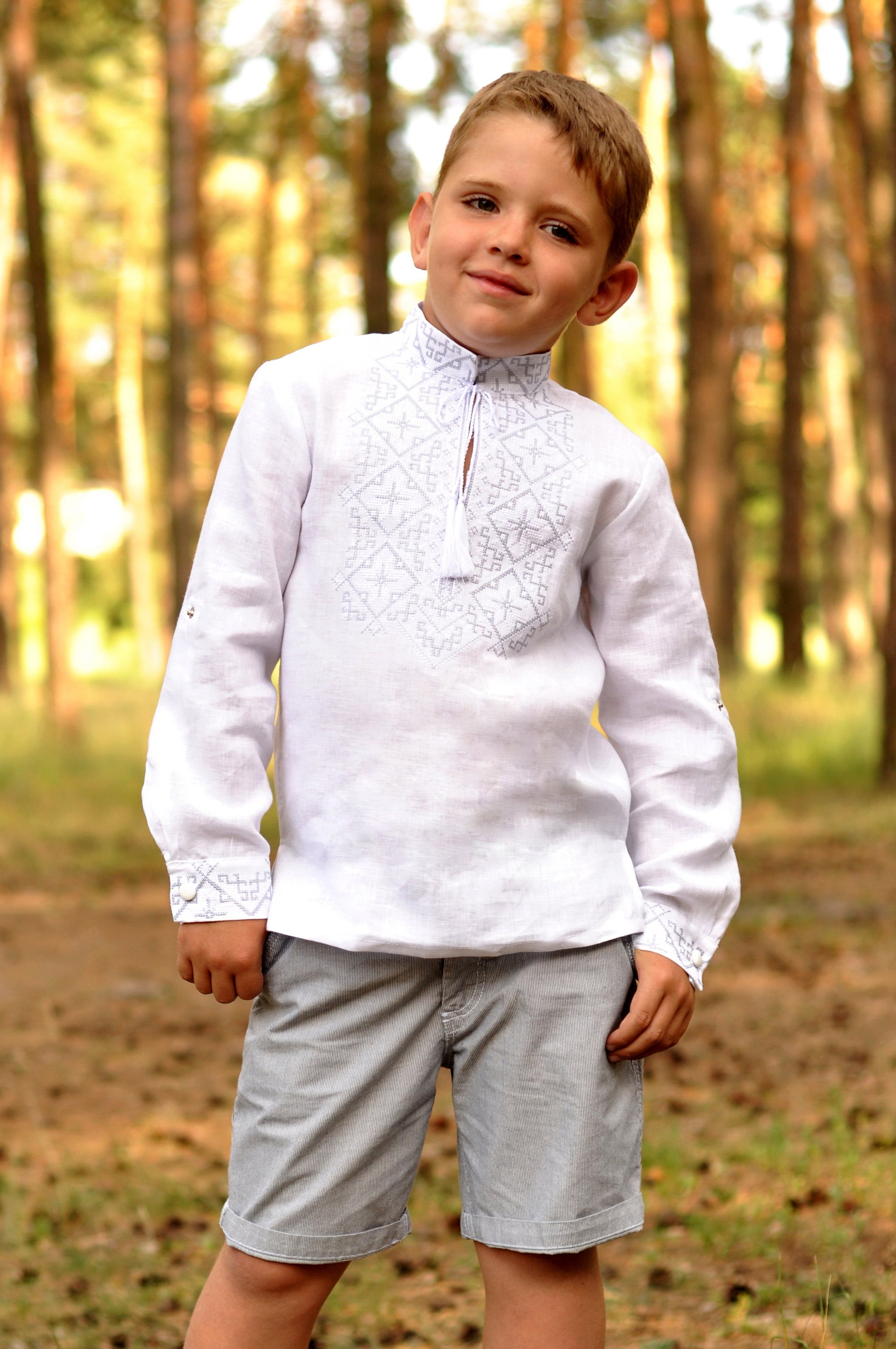 Boys’ festive white linen vyshyvanka with elegant silver-toned embroidery