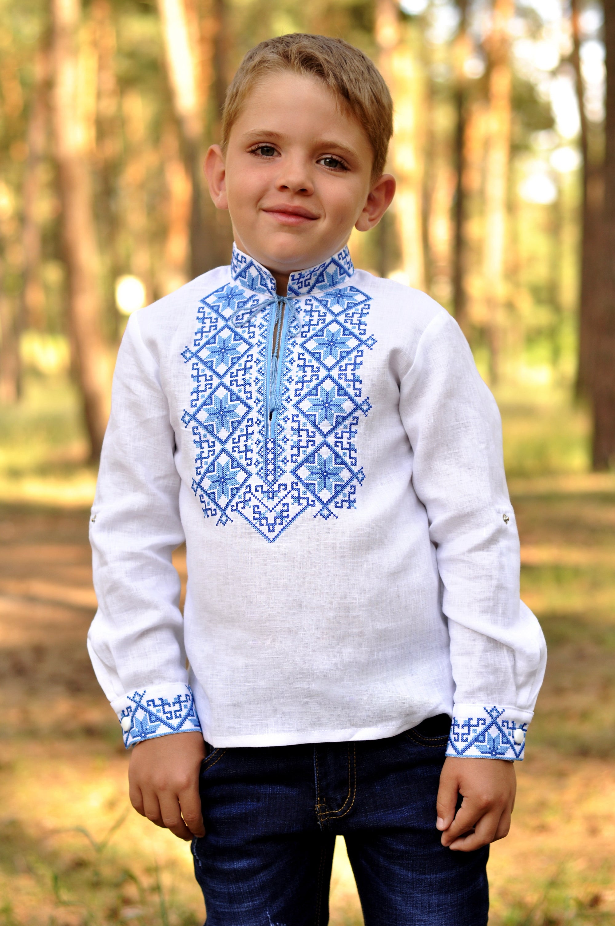 Festive boys’ white linen vyshyvanka with double-cross blue embroidery