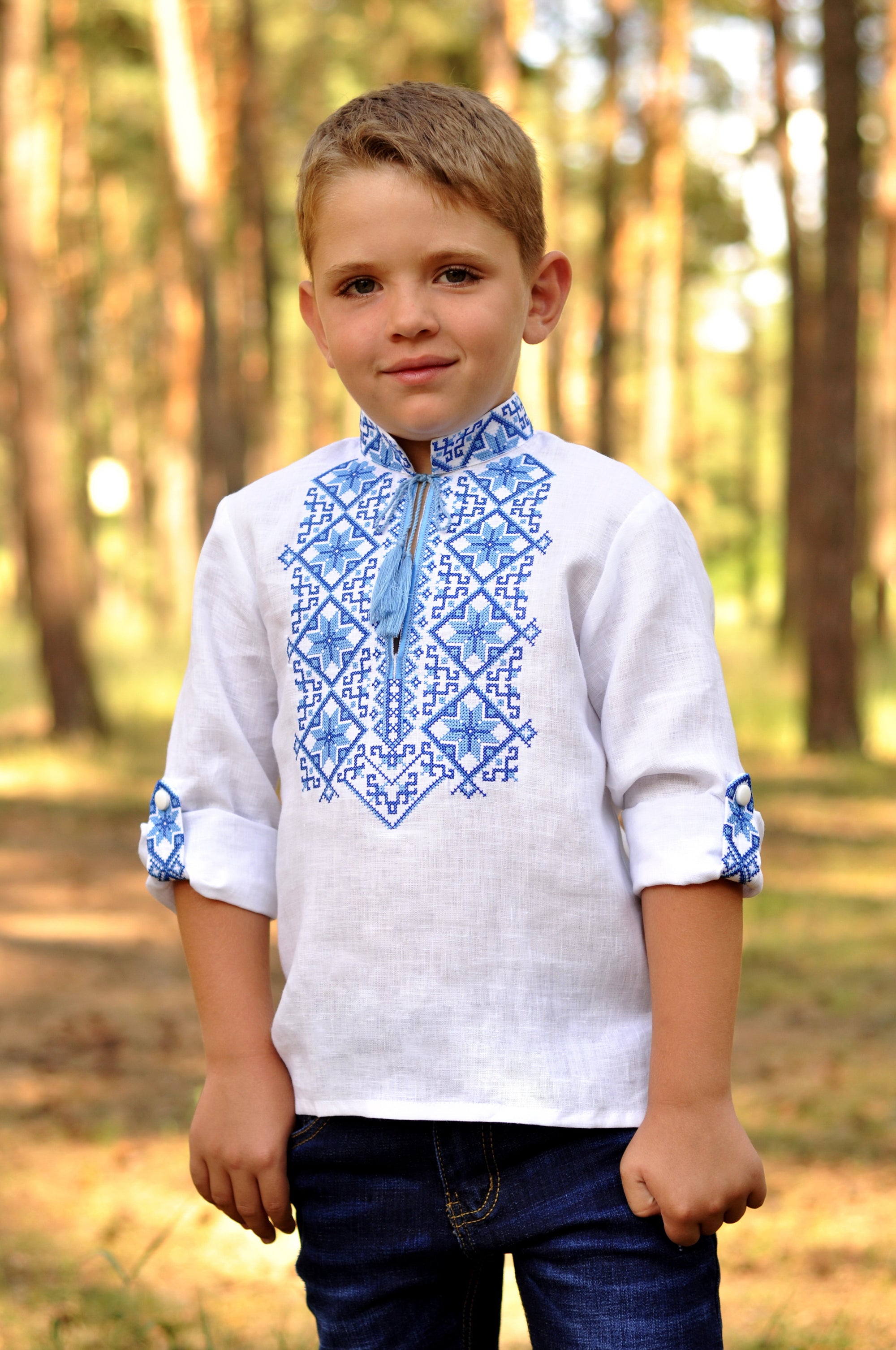 Festive boys’ white linen vyshyvanka with double-cross blue embroidery and 3/4 sleeves