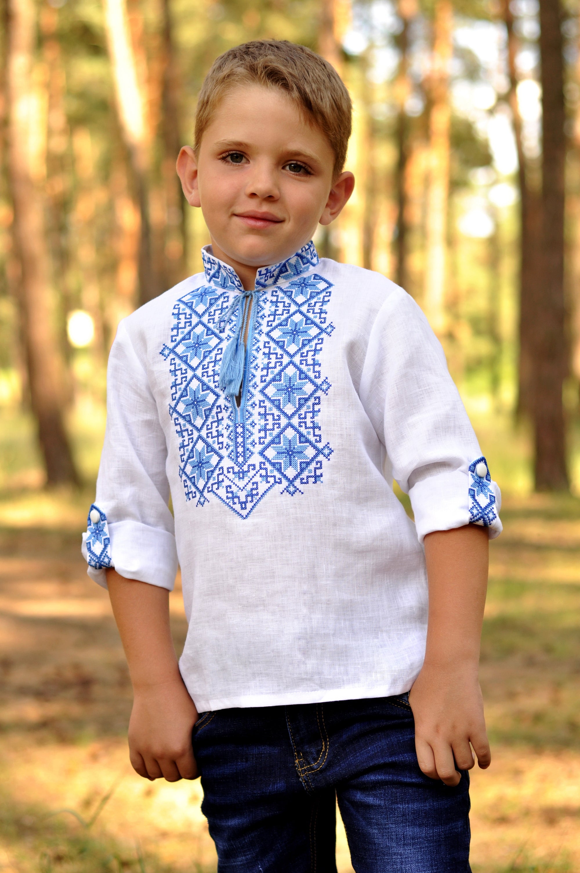 White linen boys’ vyshyvanka with volumetric blue embroidery and transformable sleeves