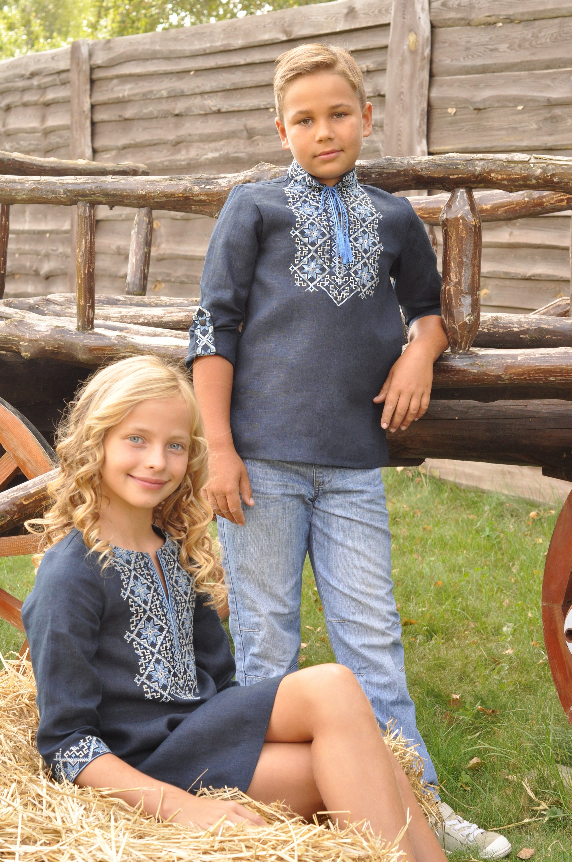 Festive boys’ linen vyshyvanka with light blue and milky geometric ornament and embroidered cuffs