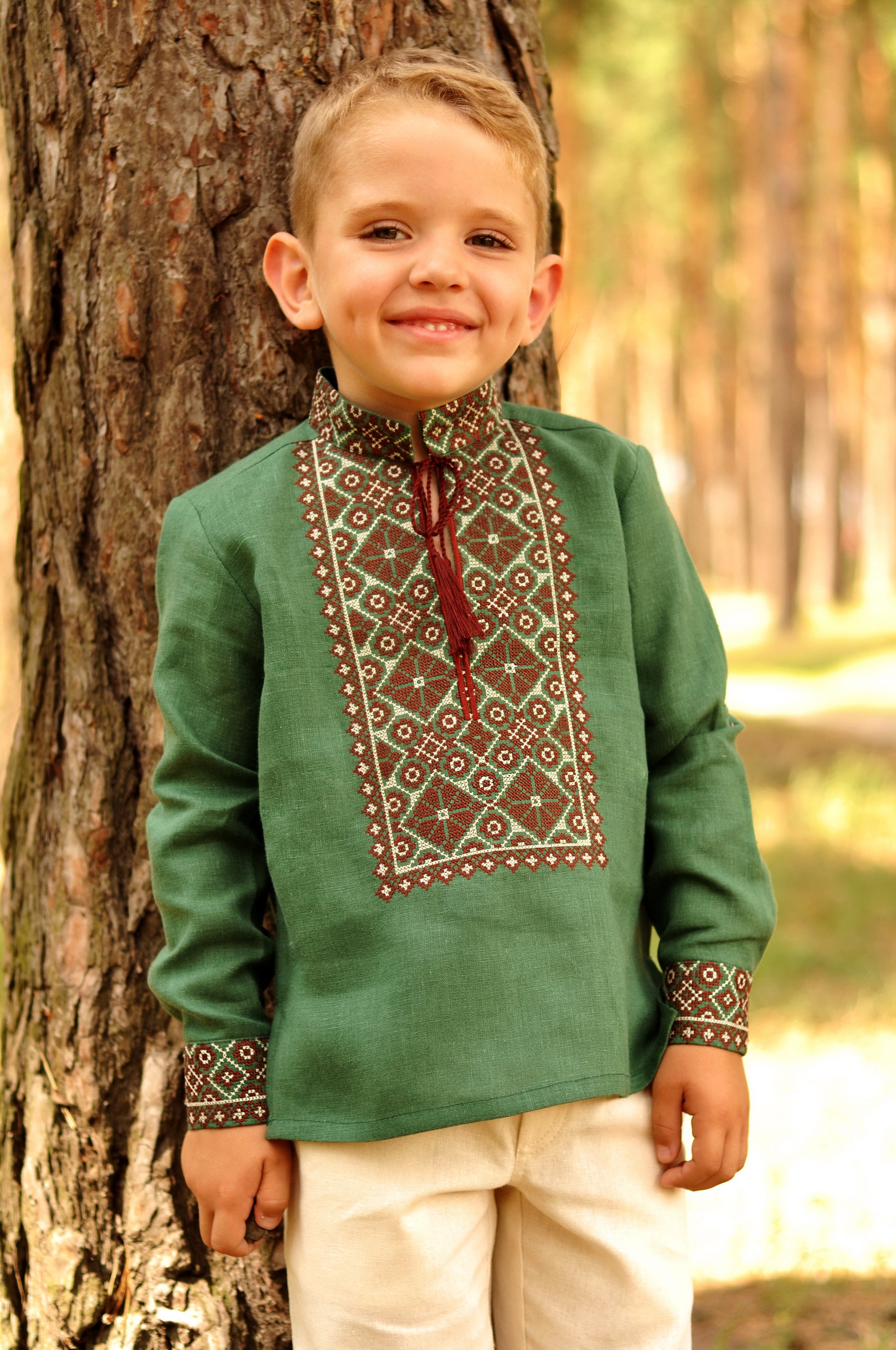Green boys’ Ukrainian-style embroidered shirt with long sleeves and brown embroidery