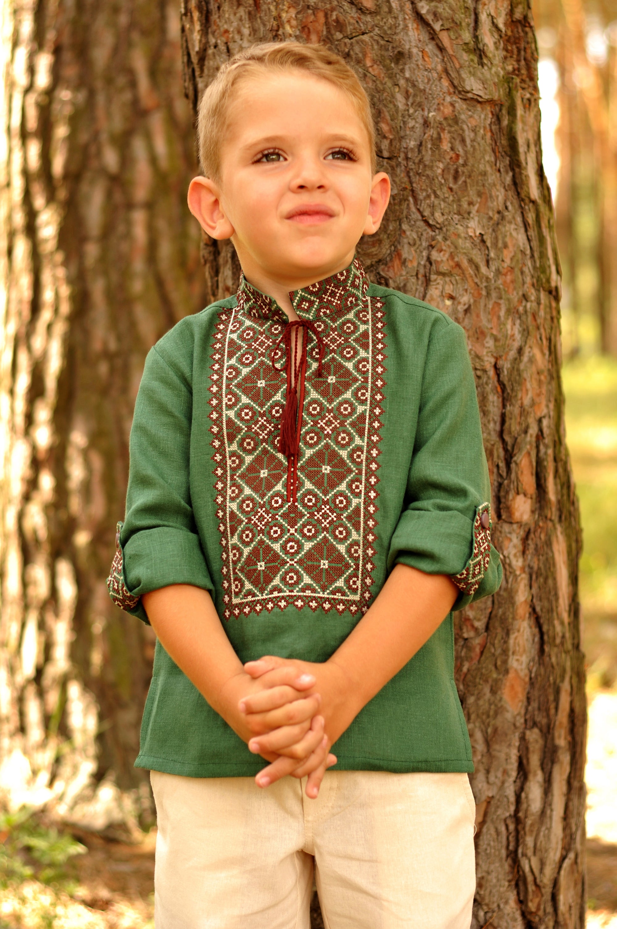 Green boys’ Ukrainian-style embroidered shirt with long sleeves and brown embroidery