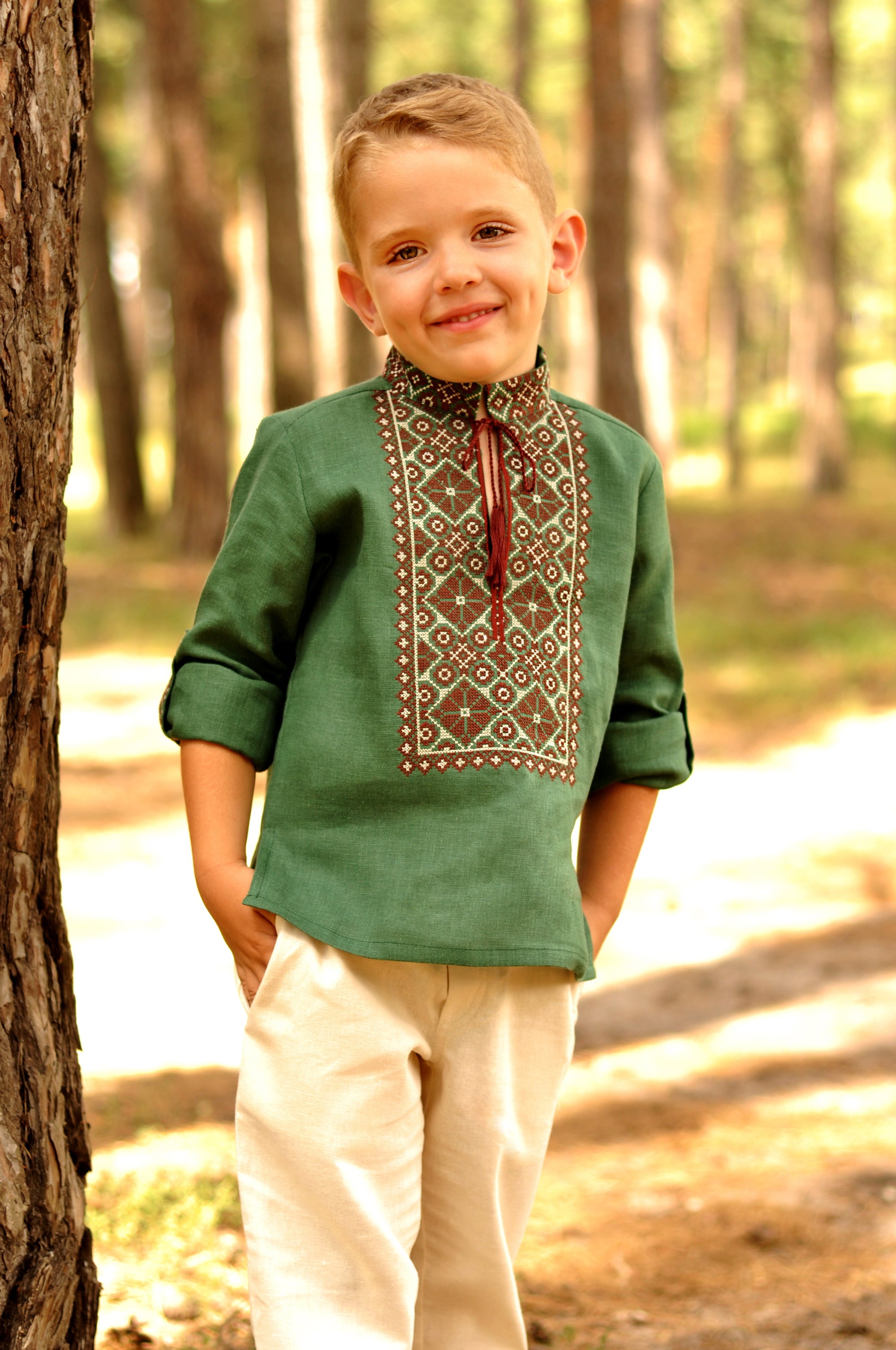 Boys’ green embroidered linen shirt with stand collar and traditional ornament