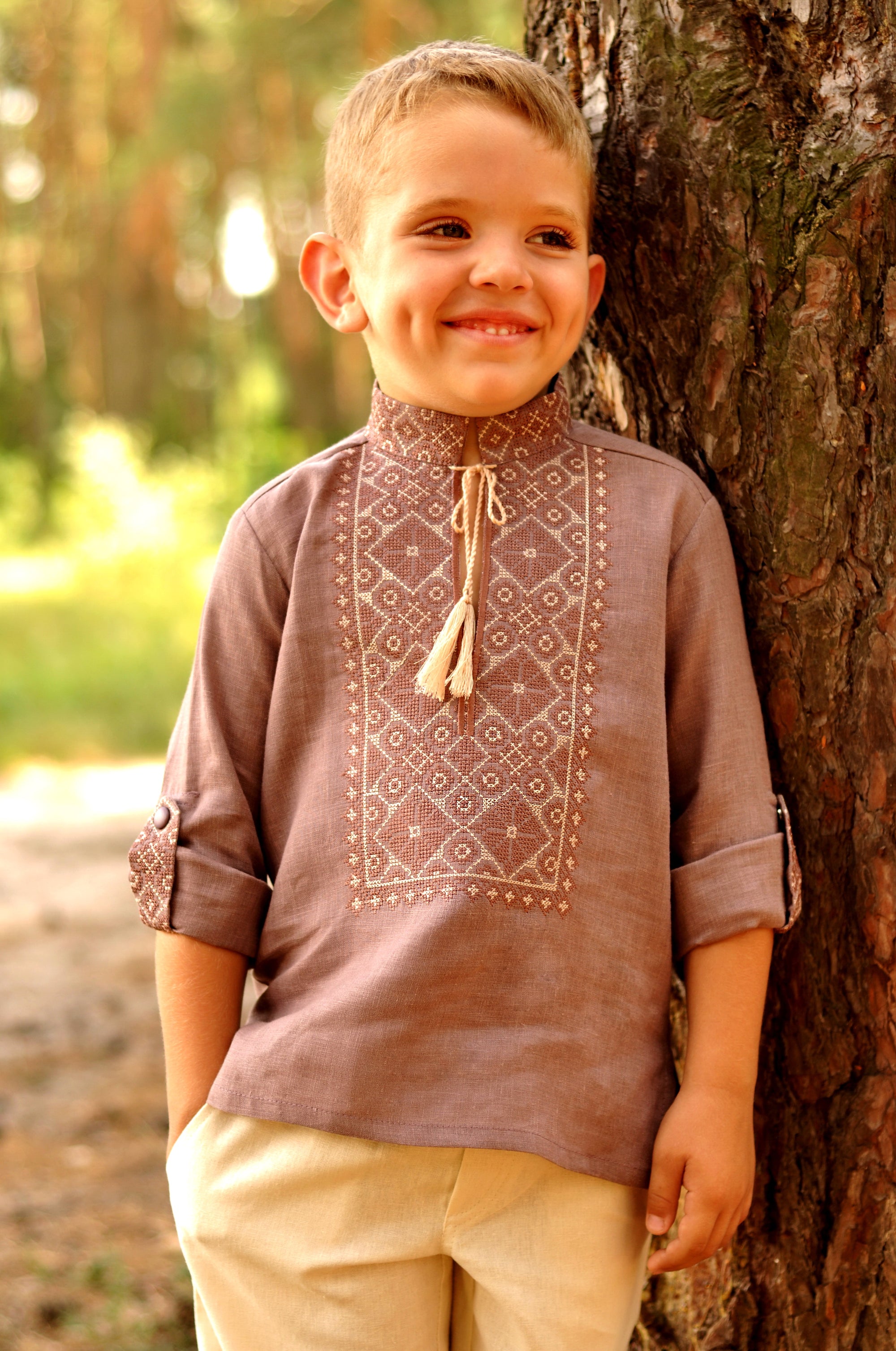 Cocoa linen boys’ vyshyvanka with beige geometric embroidery and sleeves styled as 3/4