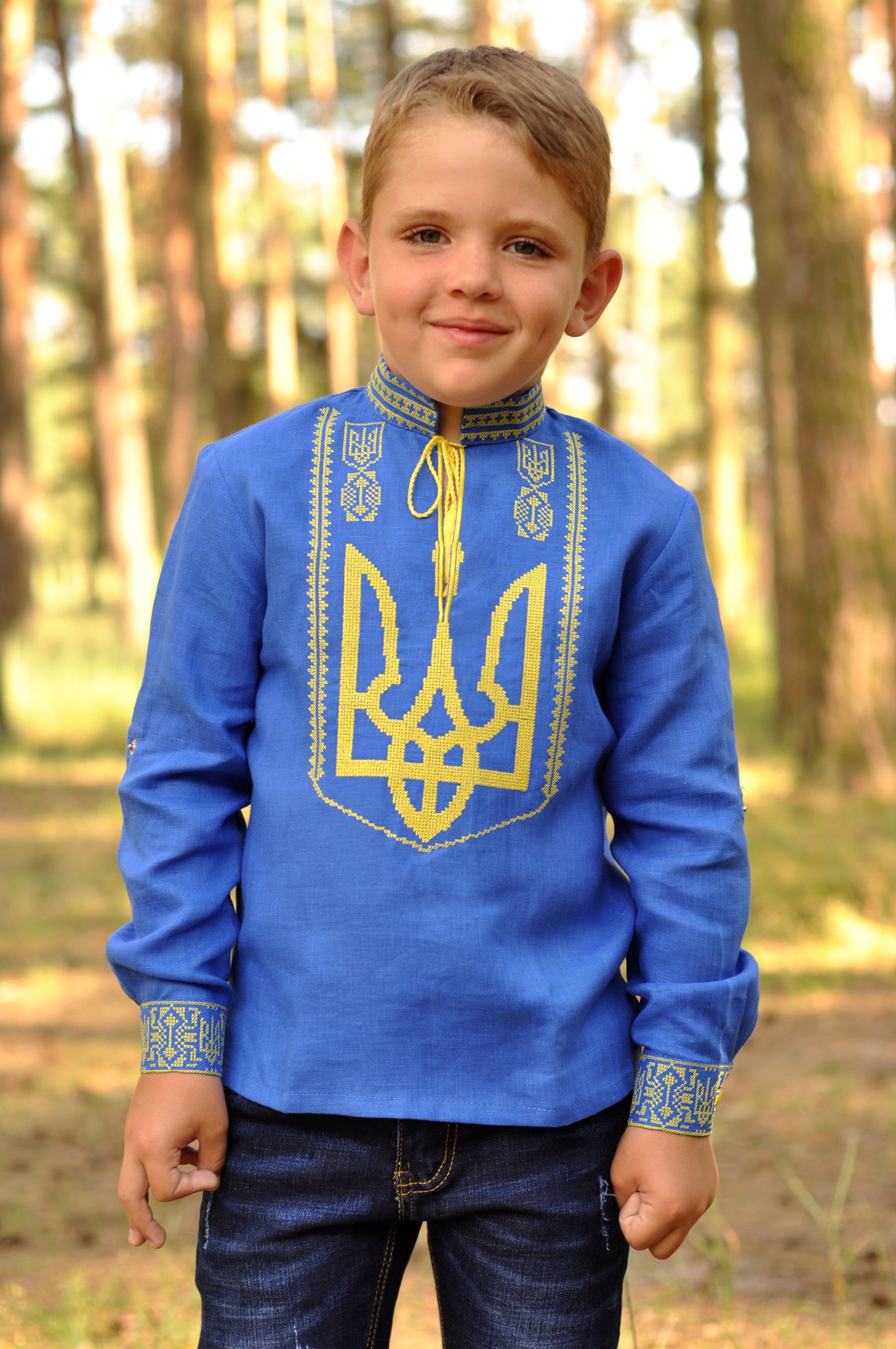 Boys’ blue embroidered linen shirt with Ukrainian coat of arms motif