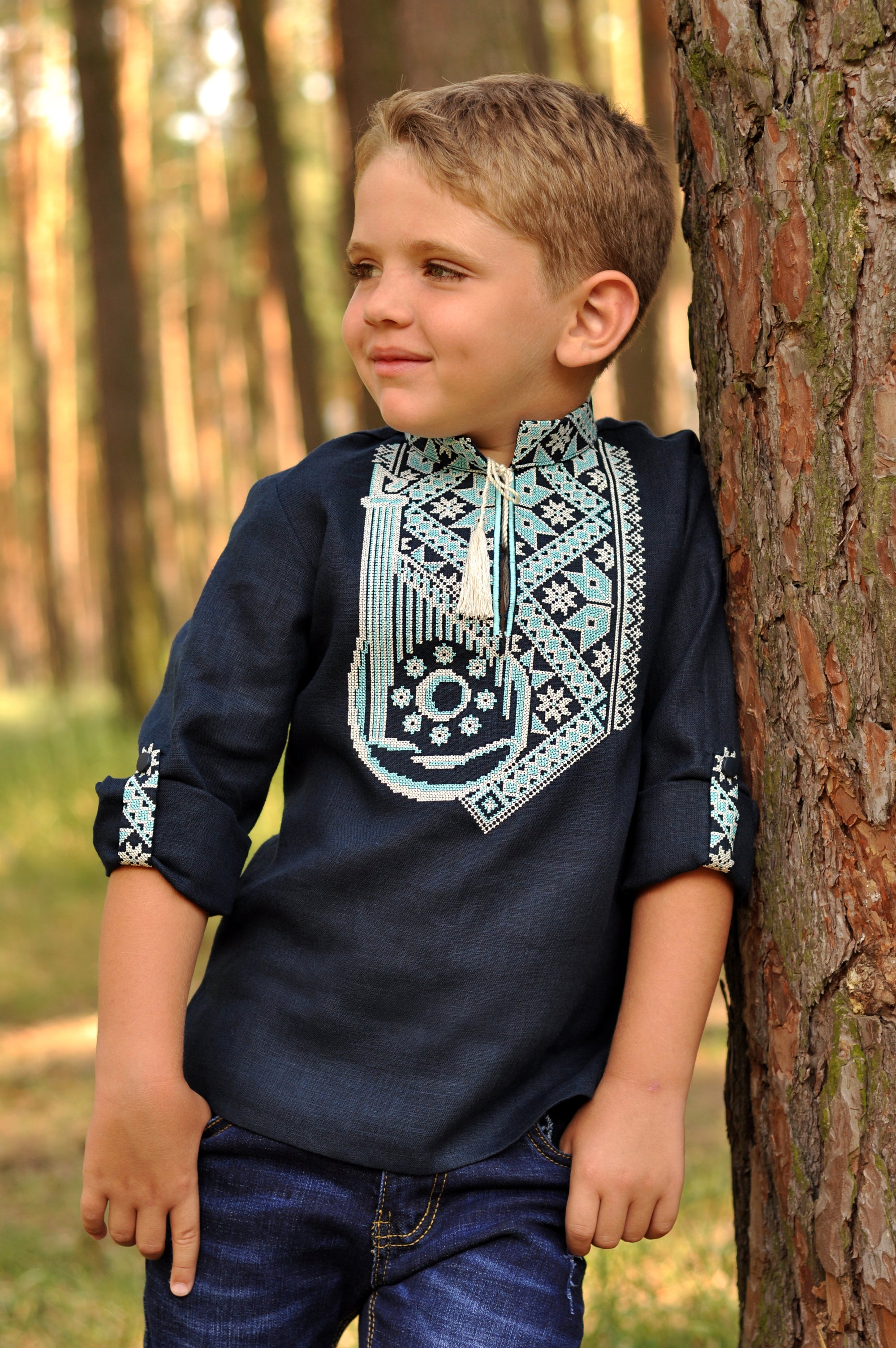 Navy linen boys’ vyshyvanka with embroidered bandura motif and transformable sleeves