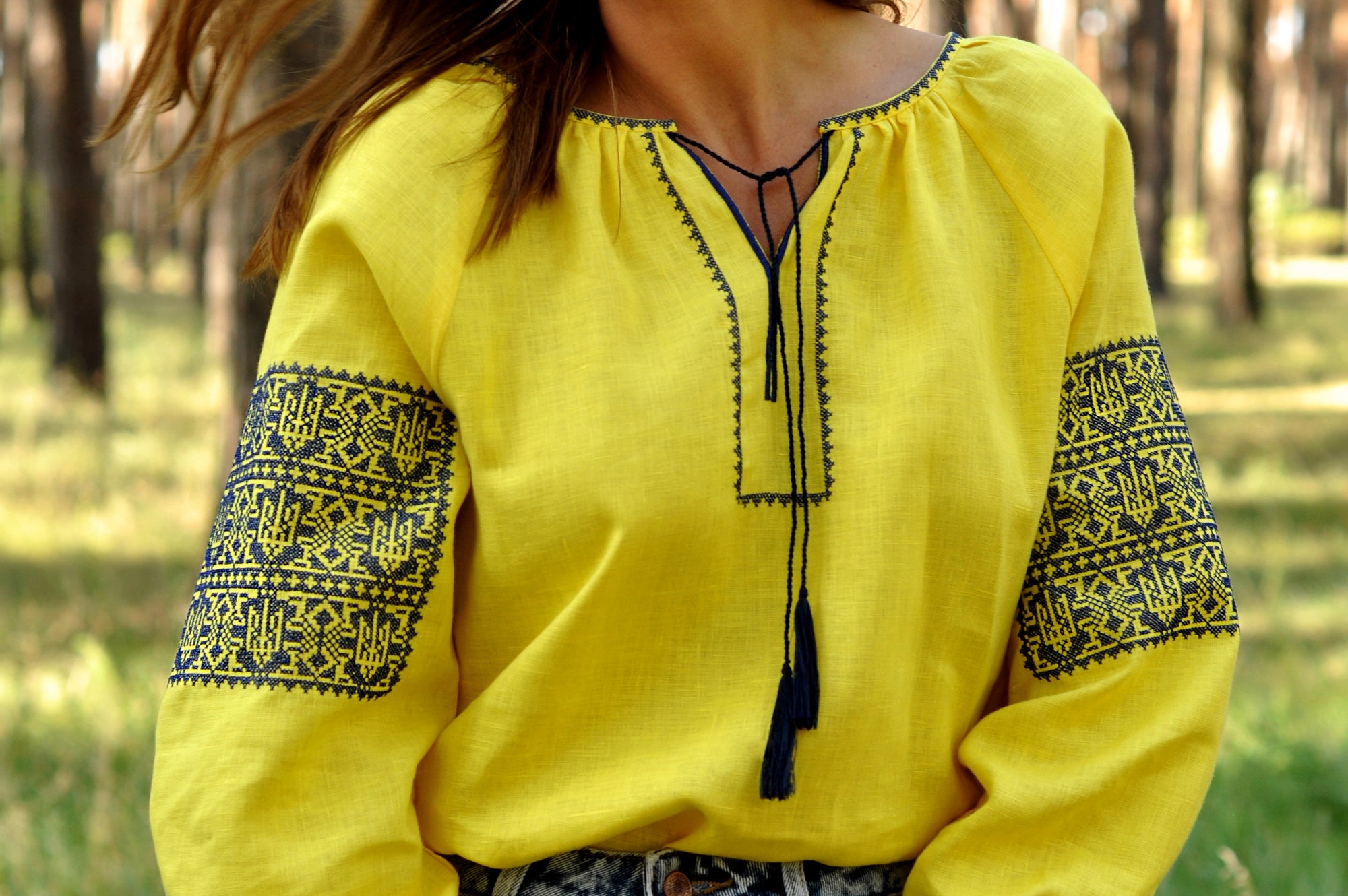Yellow women’s vyshyvanka with geometric ornament inspired by the Ukrainian flag