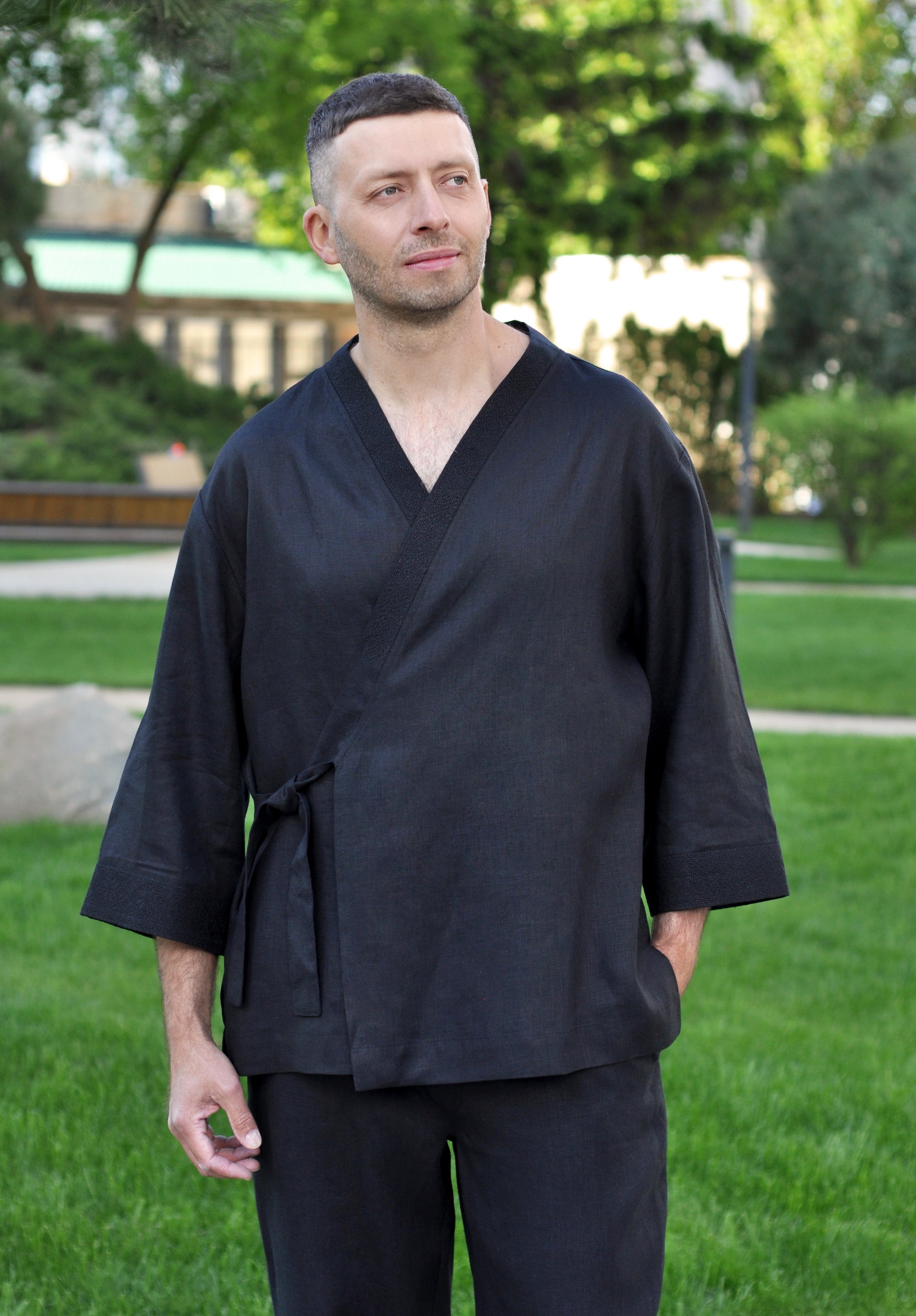 Men’s black linen outfit with embroidered kimono top and relaxed straight-cut trousers