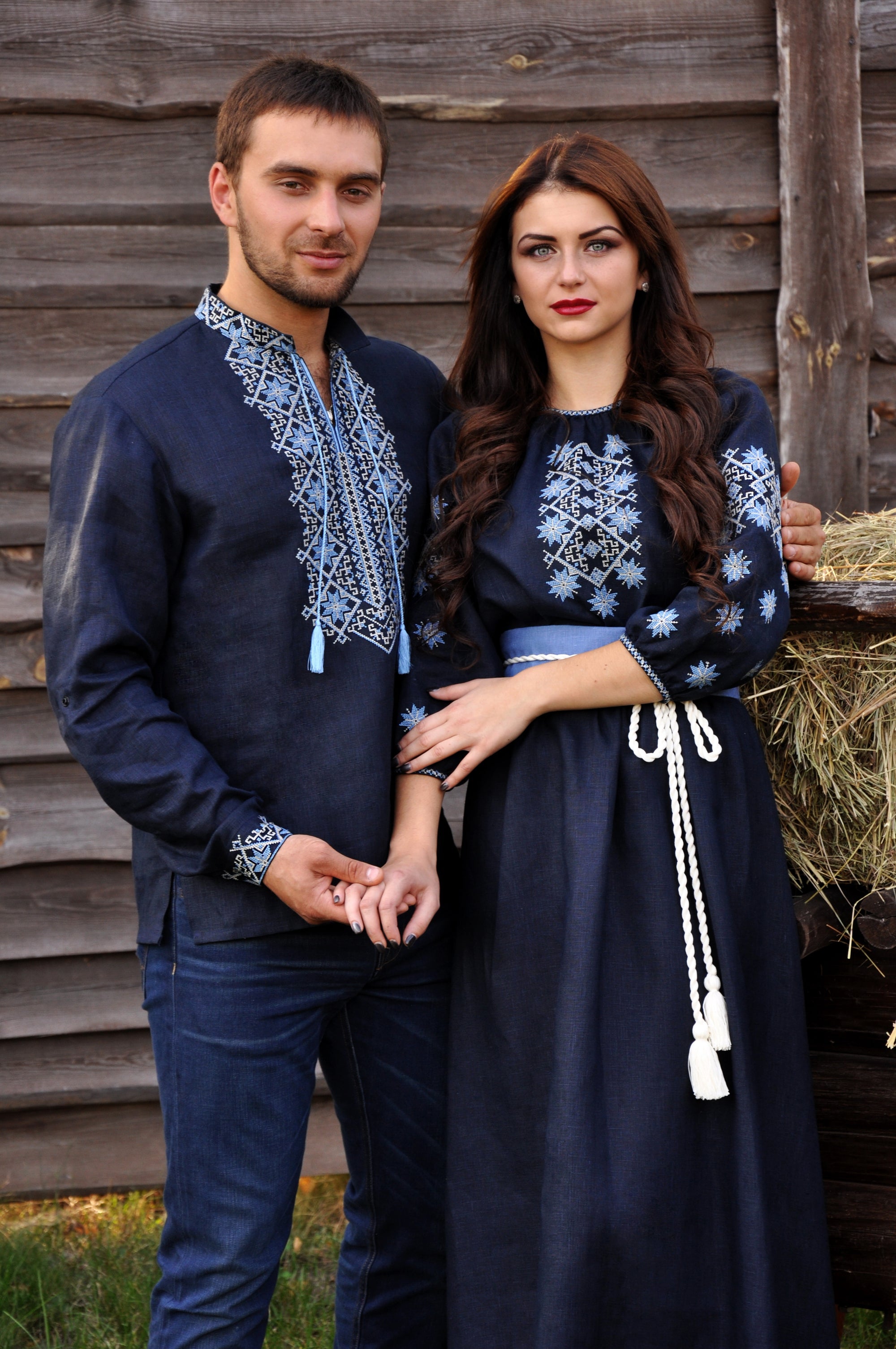 Dark navy embroidered linen outfit for couples with light blue and milk-toned ornament