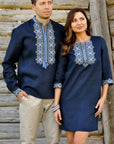 Dark navy embroidered linen outfit for couples with light blue and milk-toned ornament