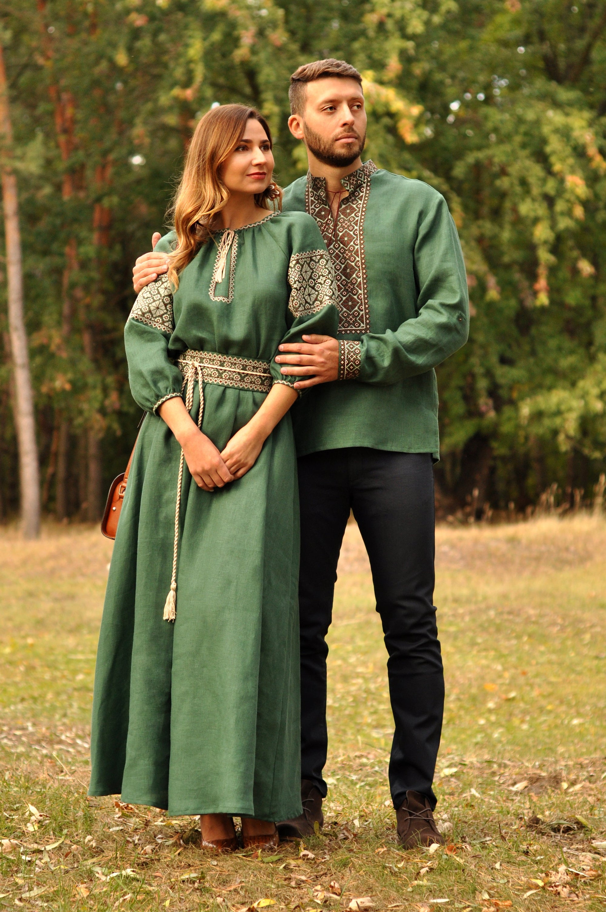 Matching green linen couple set with men’s embroidered shirt and women’s embroidered maxi dress