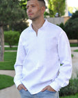 Close-up of white-on-white geometric embroidery on a men’s linen shirt