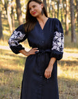 Dark blue linen dress with feminine silhouette and symbolic rose motif