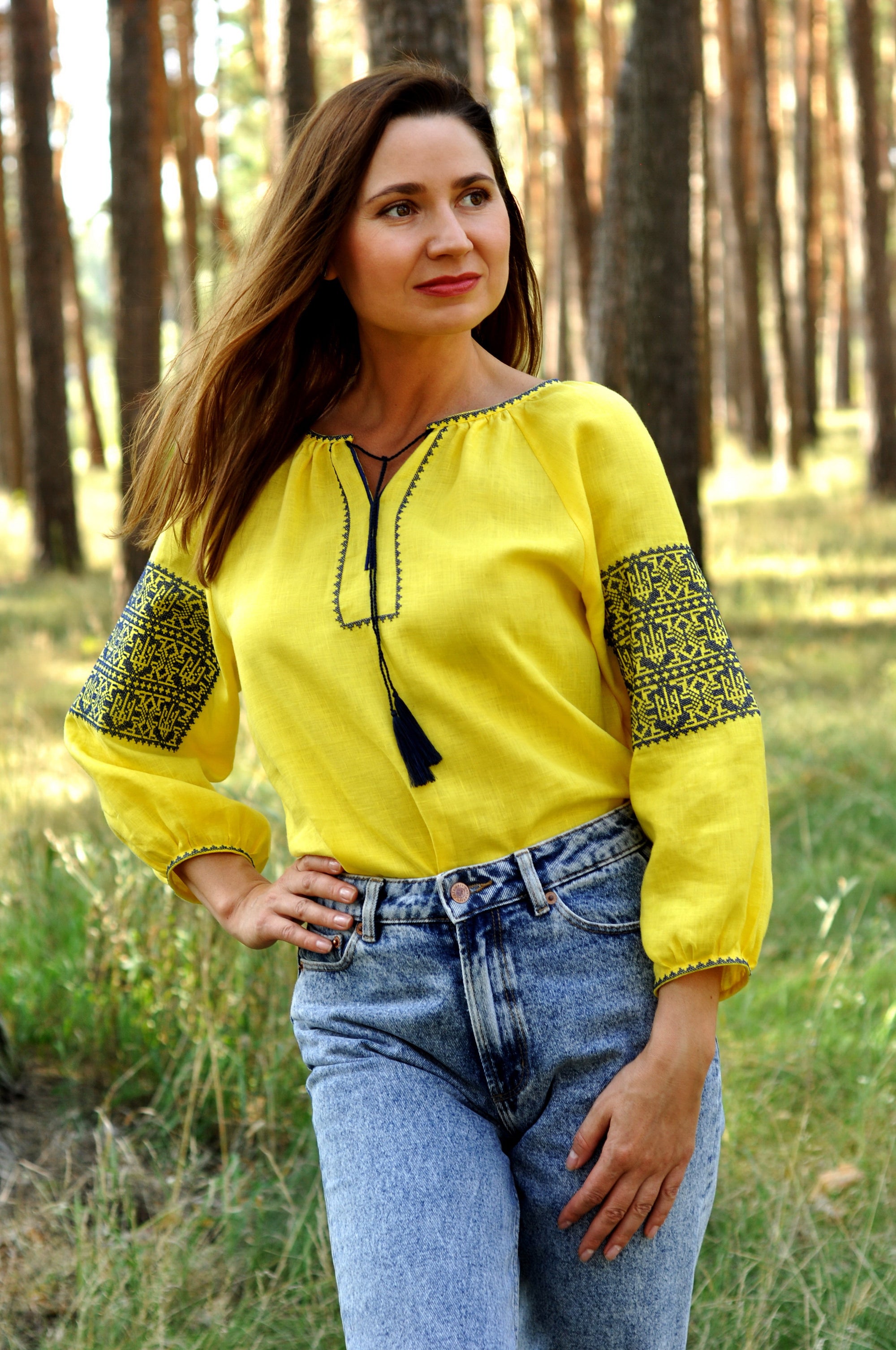 Yellow women’s vyshyvanka with geometric ornament inspired by the Ukrainian flag