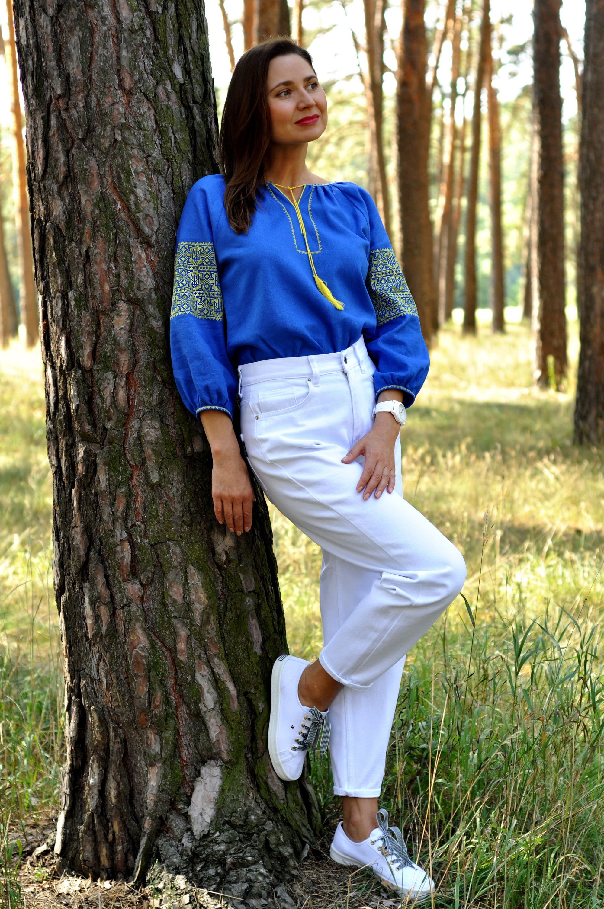 Blue women’s vyshyvanka with geometric ornament inspired by the Ukrainian flag
