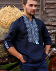 Men’s navy embroidered linen shirt with transformable sleeves and detailed front embroidery