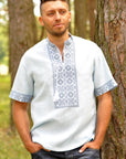 Light embroidered men`s shirt with short sleeve