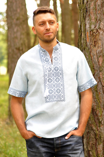 Light embroidered men`s shirt with short sleeve