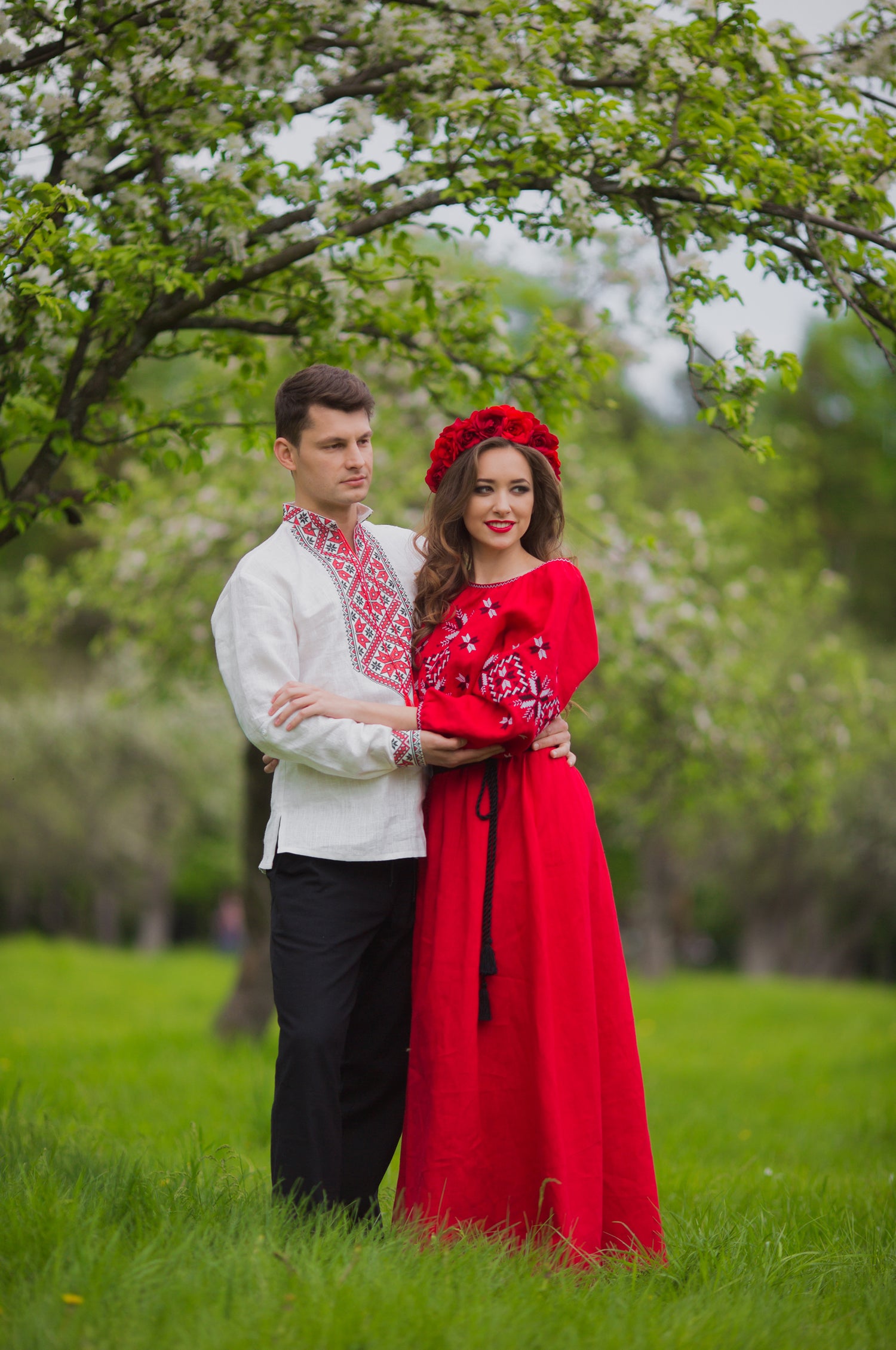 Matching couple outfit in natural linen featuring a men’s embroidered shirt and women’s embroidered dress in Ukrainian style