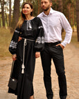 Matching cotton couple set with men’s white embroidered shirt and women’s black maxi dress