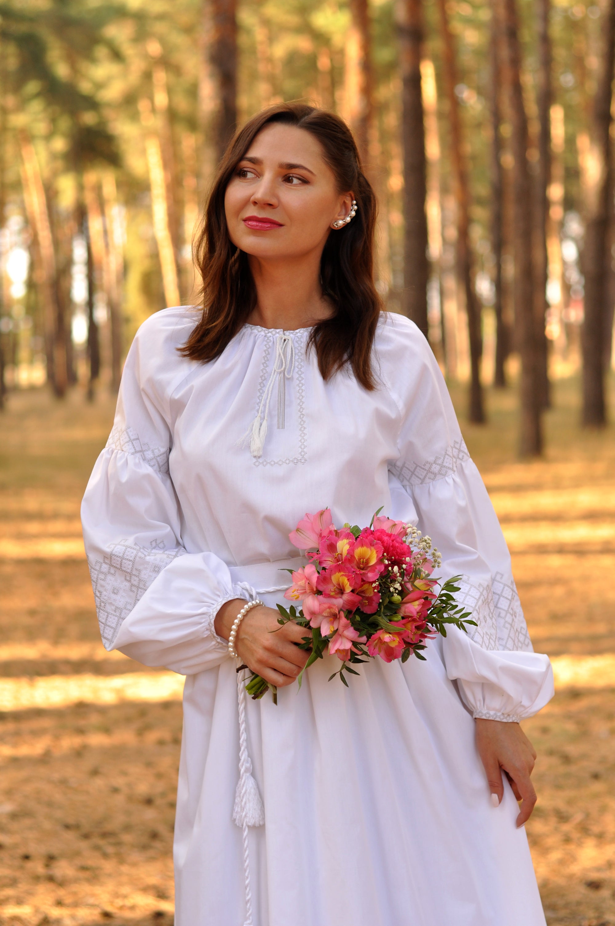 Elegant bridal dress with delicate white and silver embroidery