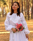 Elegant bridal dress with delicate white and silver embroidery