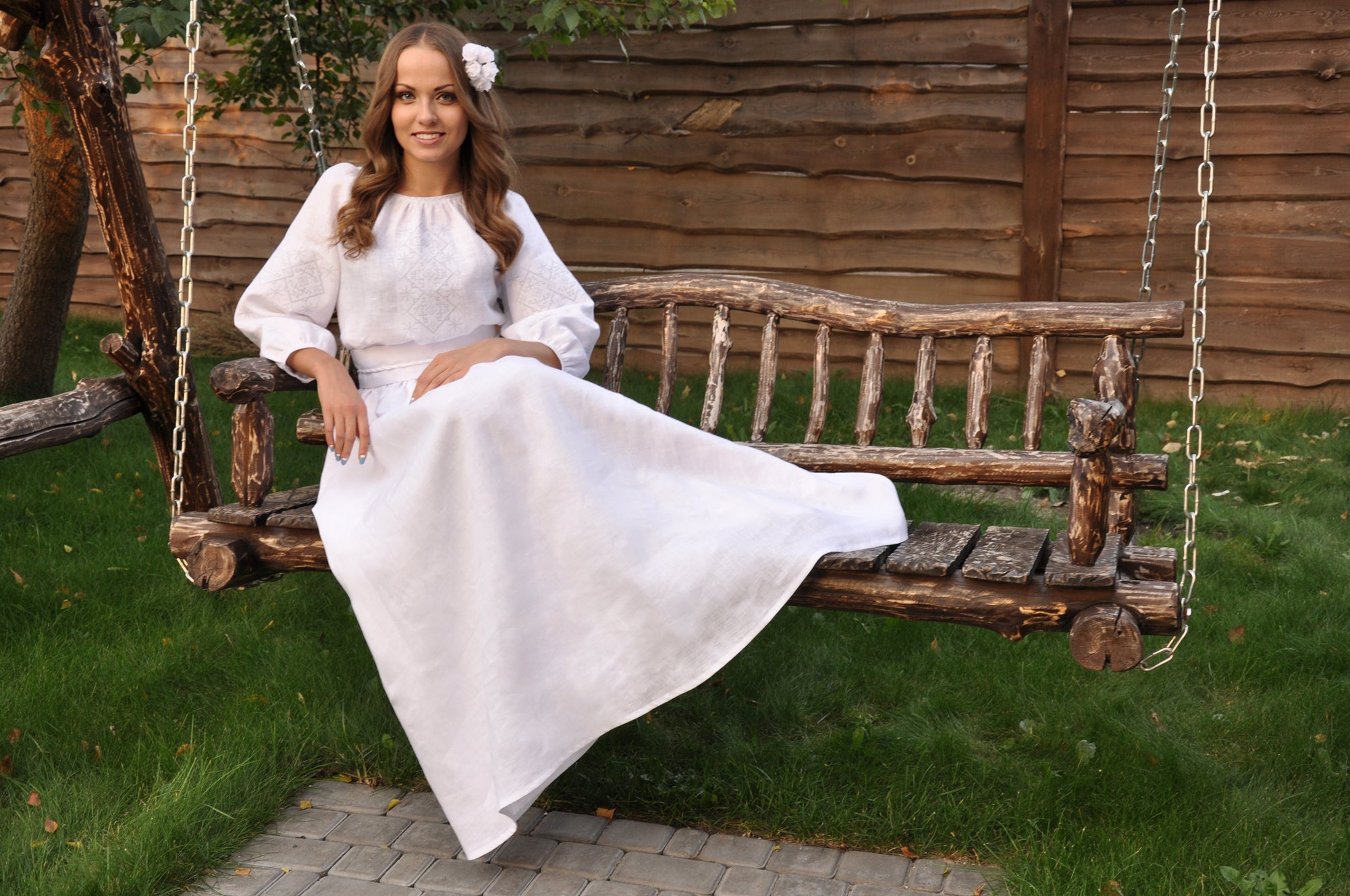 Elegant bridal dress in natural linen with gray-white ornament