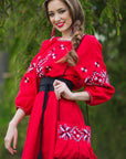 Women’s red embroidered linen dress with long sleeves and contrasting belt