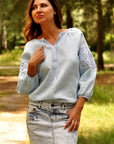 Light blue Ukrainian-style embroidered blouse for summer styling