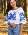 White linen women’s vyshyvanka with blue floral embroidery