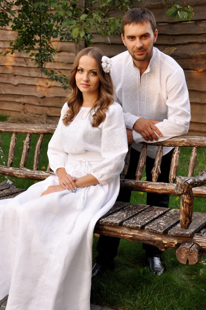 White embroidered wedding dress with long feminine silhouette